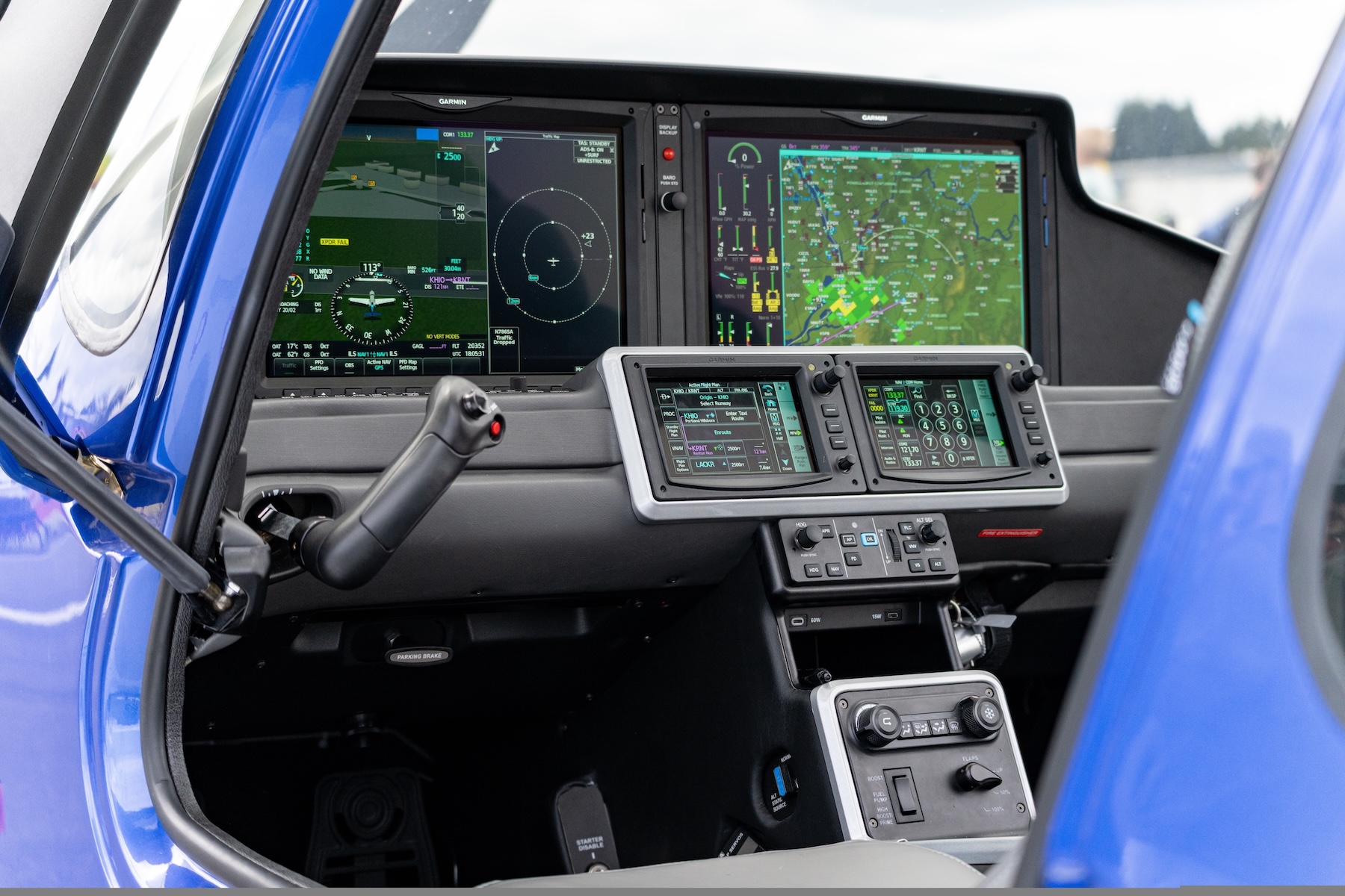 Modern general aviation aircraft cockpit with Garmin avionics and digital flight displays